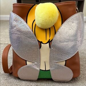 Brown Backpack with Silver Wings and Yellow Pom Pom